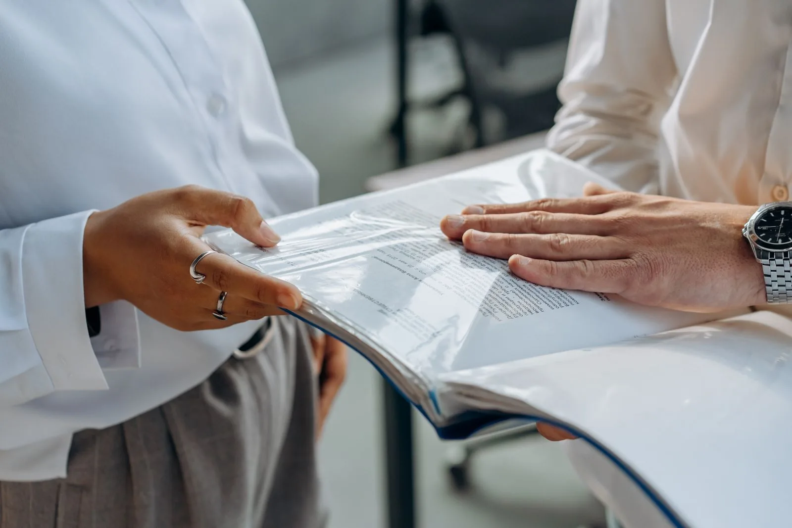 Finance professionals in a focused business conversation